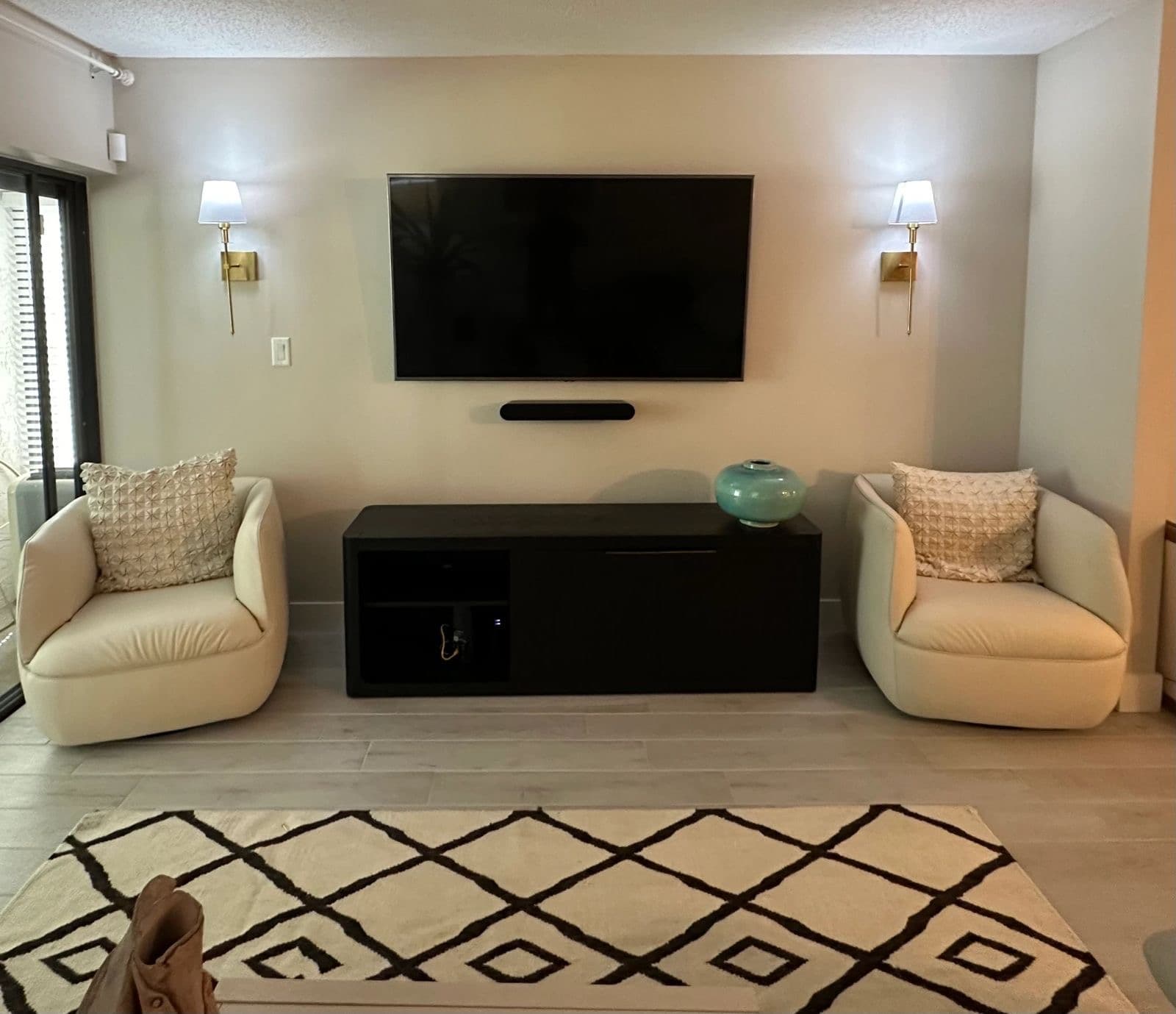 TV and soundbar mounted in a living room